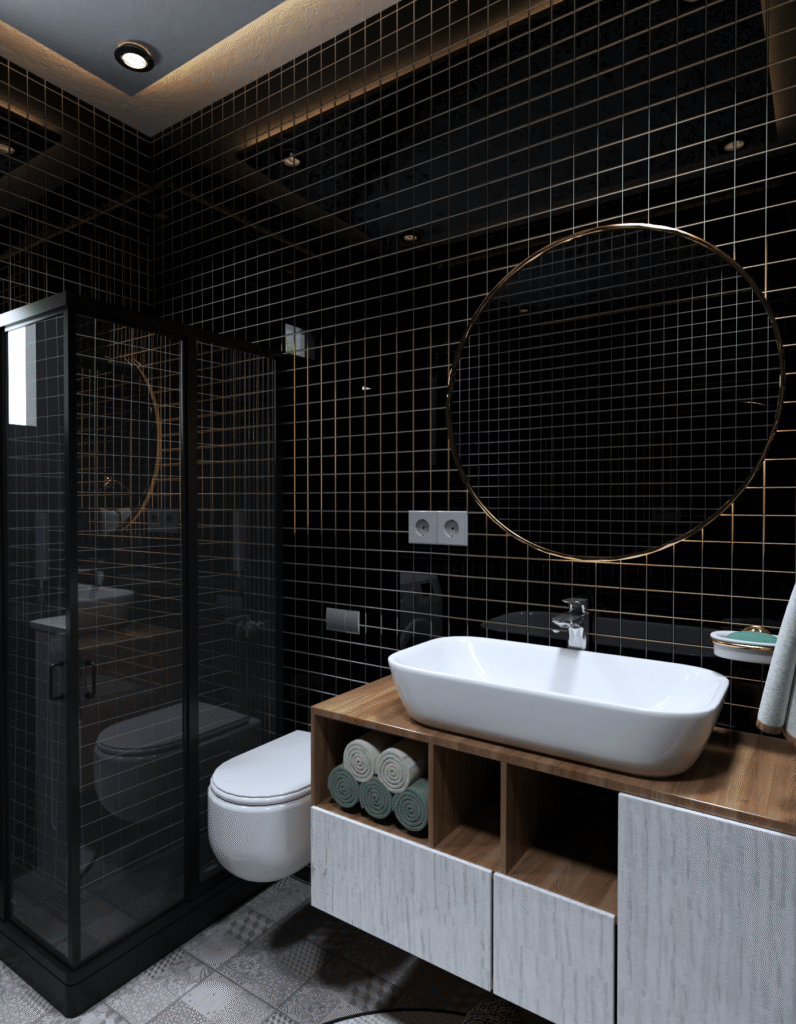 Siyah ve altın detaylı modern banyo tasarımı. Parlak siyah seramik fayans, yuvarlak ayna ve şık lavabo dolabı. Lüks banyo iç mimarisi