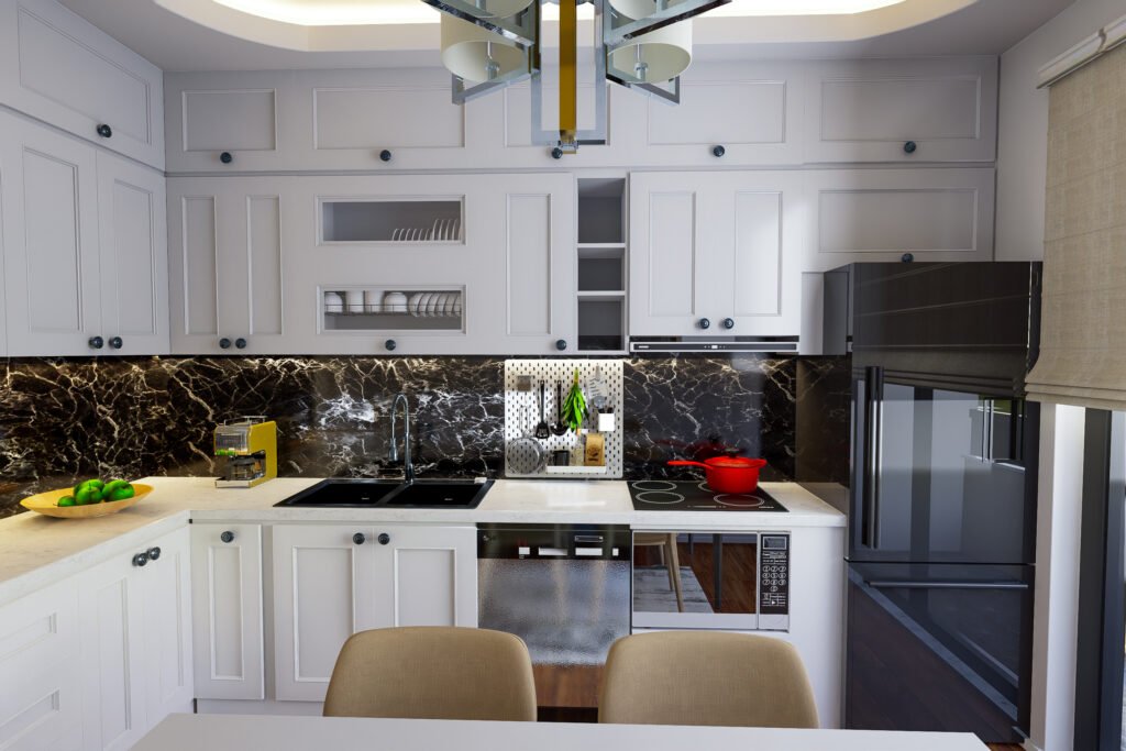 Siyah mermer backsplash ile kontrast oluşturan açık renk kuvars tezgahlı ve beyaz shaker kapaklı mutfak.