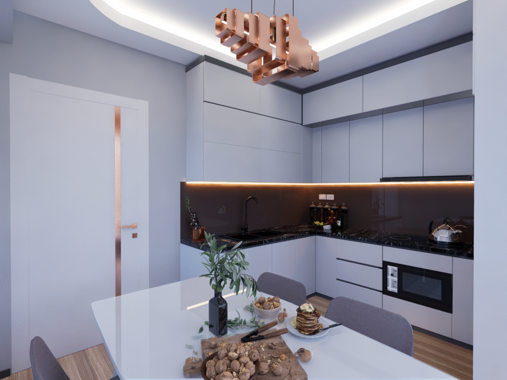 Açık tonlarda, mermer detaylı modern mutfak tasarımı. Geniş yemek masası, altın metal ayaklı sandalyeler ve şık bir avize görülüyor