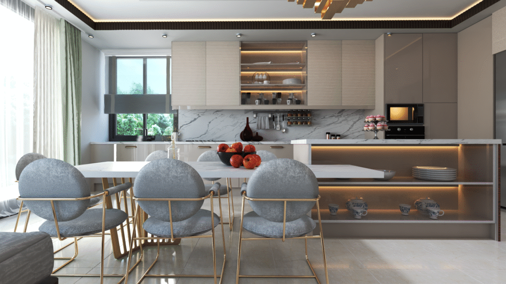 Açık konsept bir dairede yer alan modern mutfak ve yemek alanı. Mermer kaplama tezgah, altın renkli sandalyeler ve minimalist aydınlatmalarla şık bir görünüm.