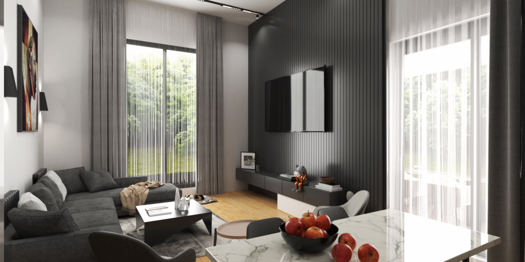 Salon ve Mutfak İç Mimari Tasarımları alon ve mutfağın bir arada bulunduğu modern bir dairenin iç mekanı. Koyu gri köşe koltuk takımı, sade orta sehpa ve duvarda soyut bir tablo görülüyor