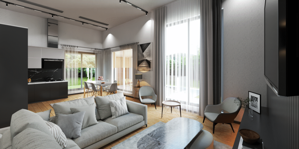 Salon ve Mutfak İç Mimari Tasarımları Salon, mutfak ve yemek alanının bir arada olduğu aydınlık ve modern iç mekan tasarımı. Gri köşe koltuk takımı, sade orta sehpa ve doğal ışık alan geniş pencerelerle ferah bir ortam