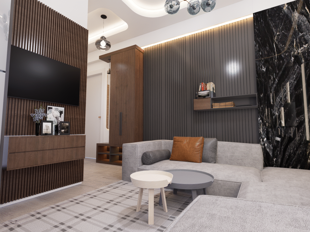 Salon ve Mutfak İç Mimari Tasarımları Salon-mutfak birleşimi olan modern bir dairenin iç tasarımı. Beyaz mutfak dolapları ve gri kanepenin karşısında, ahşap çıtalı duvara monte edilmiş televizyon ünitesi yer alıyor.