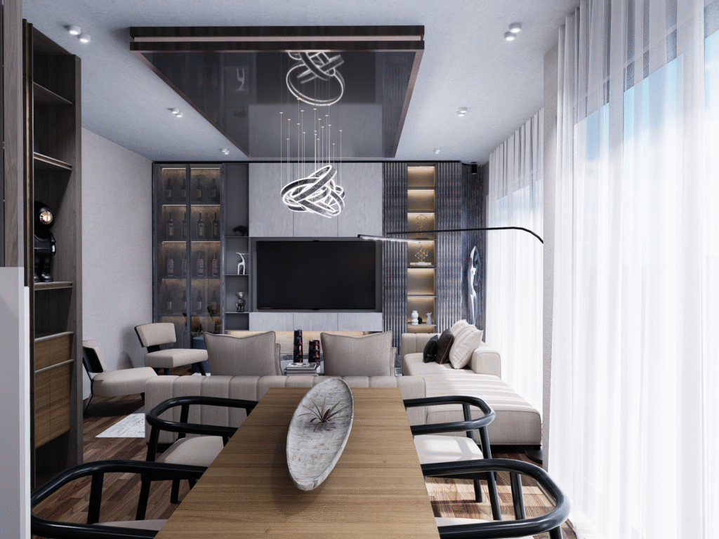 Salon ve Mutfak İç Mimari Tasarımları Modern bir villanın salonunda, beyaz mermer kaplı duvarda şık bir TV ünitesi, altında sade bir TV sehpası ve dekoratif objeler.