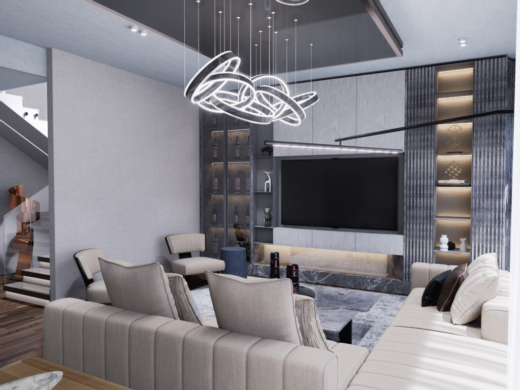 Salon ve Mutfak İç Mimari Tasarımları Salonun genel görünümü. Gri tonlarında kanepe, modern bir avize ve merdiven boşluğuna doğru uzanan bir merdiven görülüyor